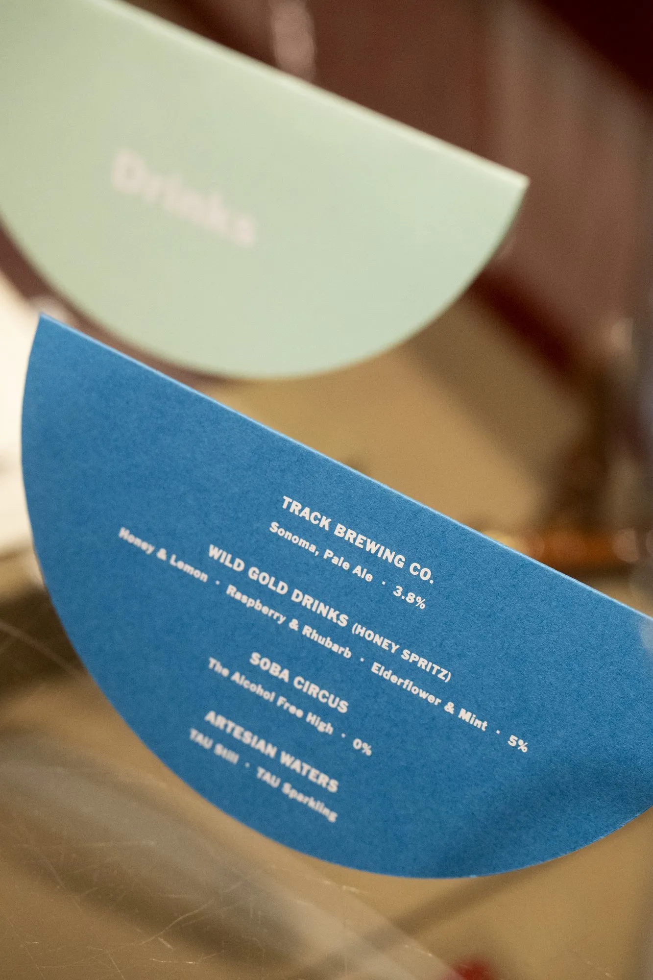 Half-moon drinks menus in blue and mint