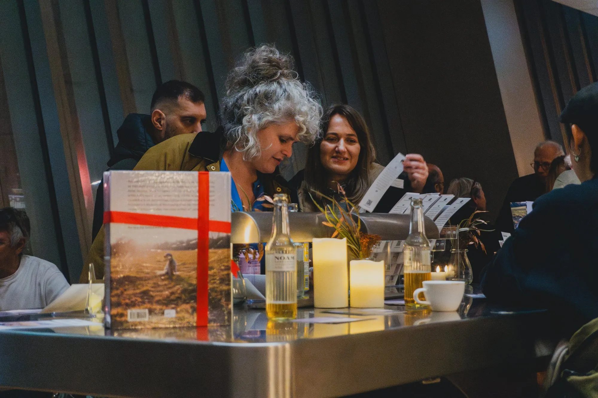Guests looking through the postcards