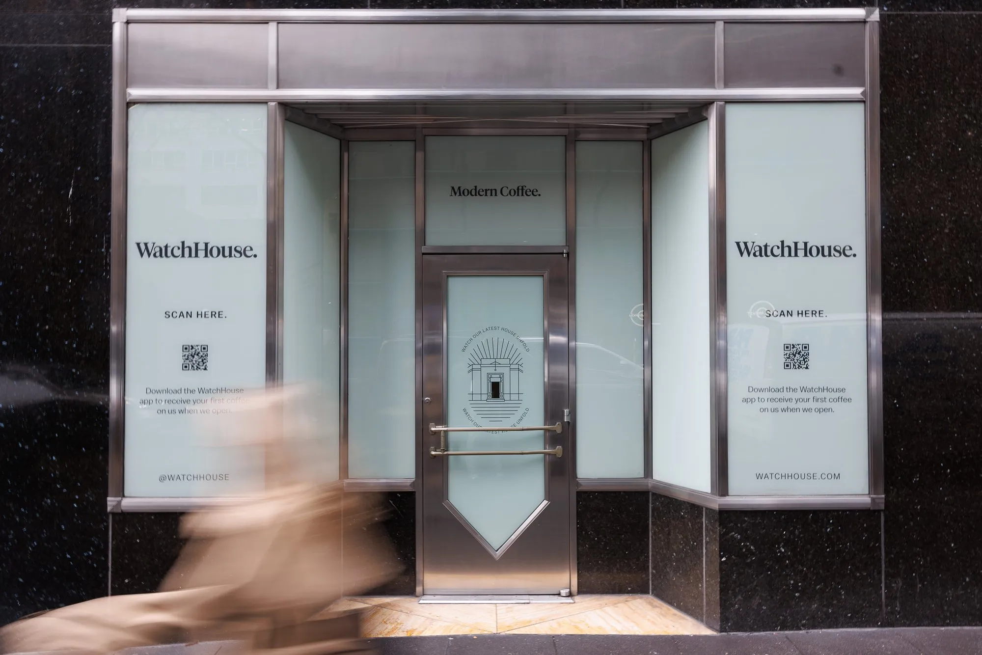 WatchHouse storefront graphics in New York, with a QR code for the app