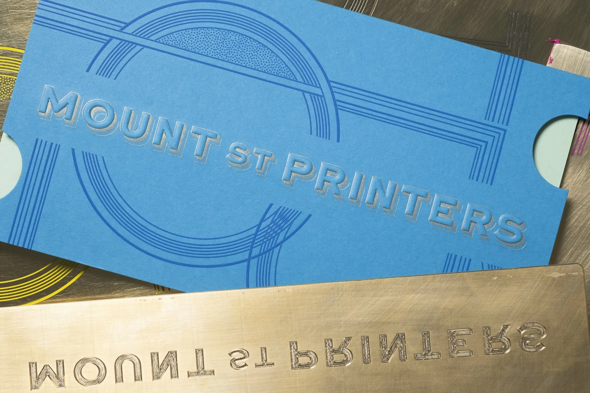 The ticket sleeve next to the brass die that stamped it