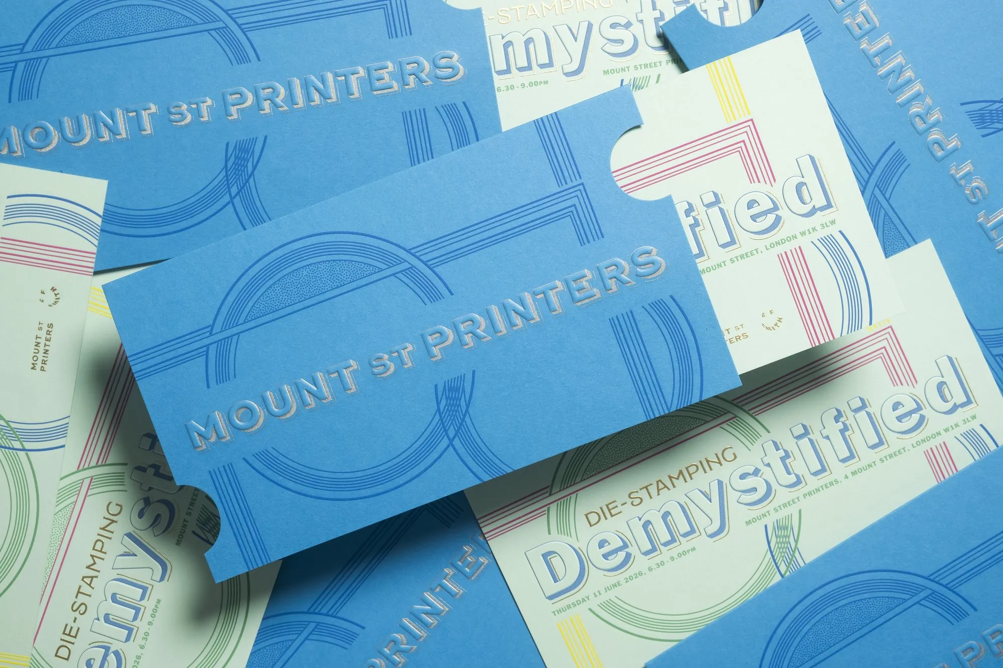 Die-stamped Mount Street Printers ticket sleeves and invitations in blue and mint